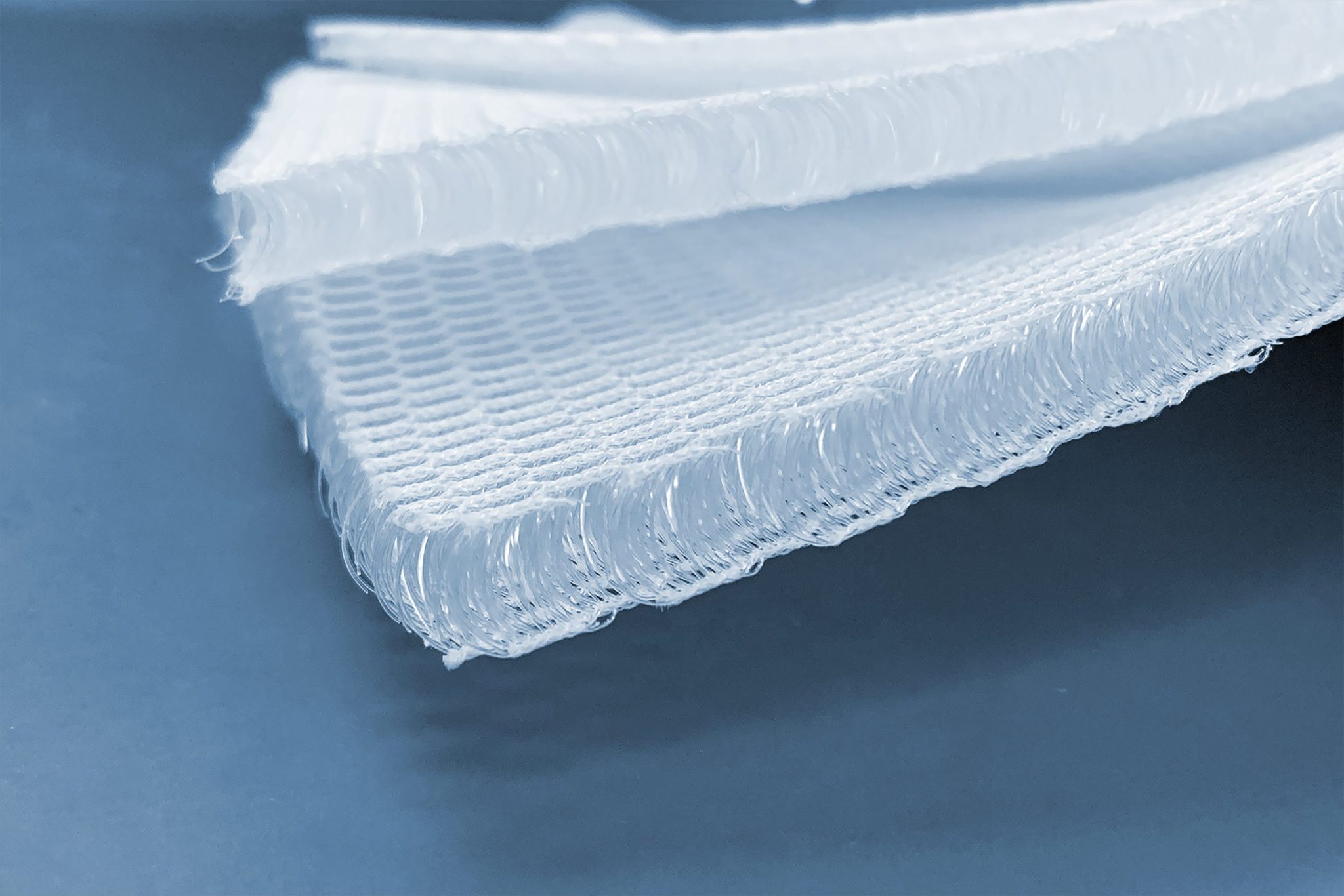 a close up of Cubit white nonwoven material texture
